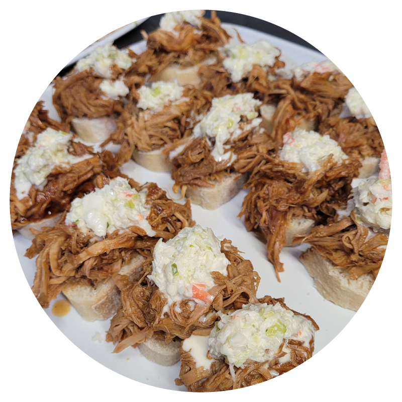 Pork-appetizer-with-cole-slaw-in-circle Shredded pork appetizer with Cole slaw.